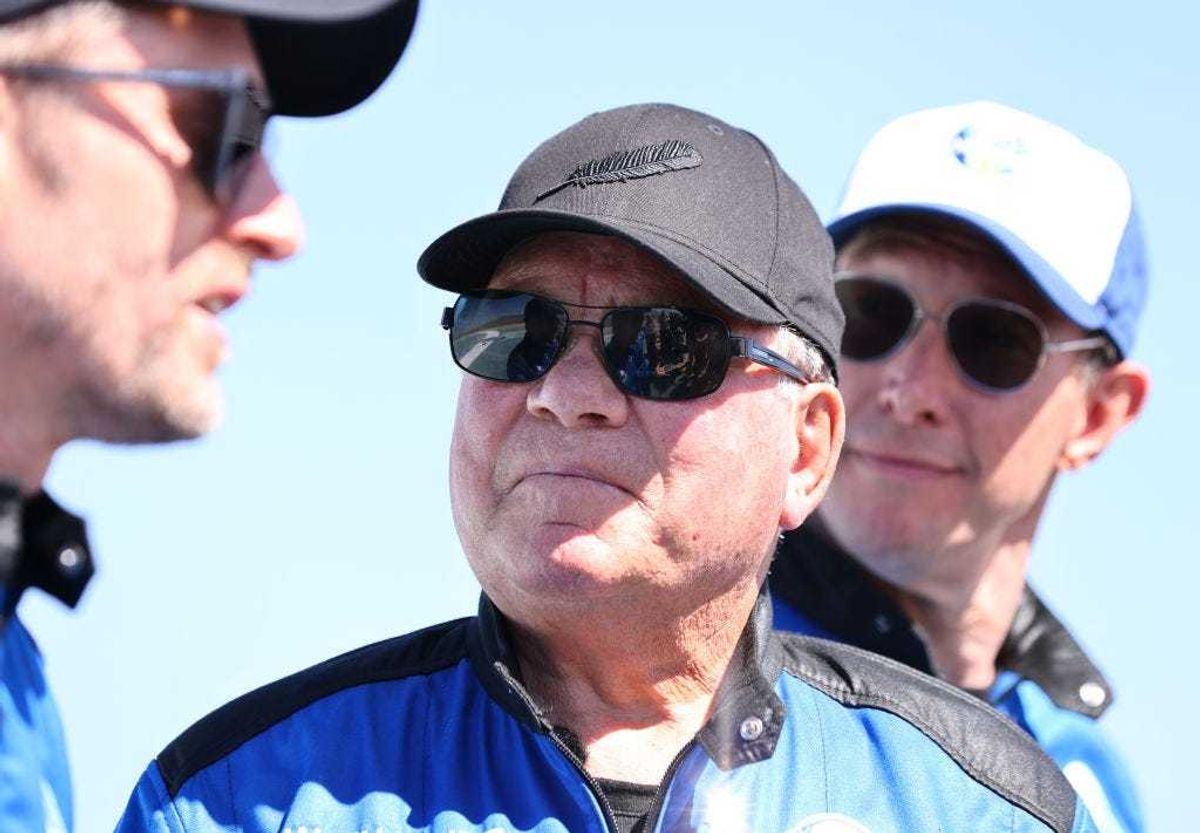 (L-R) Planet Labs co-founder Chris Boshuizen, Star Trek actor William Shatner, and Medidata Solutions co-founder Glen de Vries attend a media availability on the landing pad of Blue Origin’s New Shepard after they flew into space on October 13, 2021 near Van Horn, Texas.