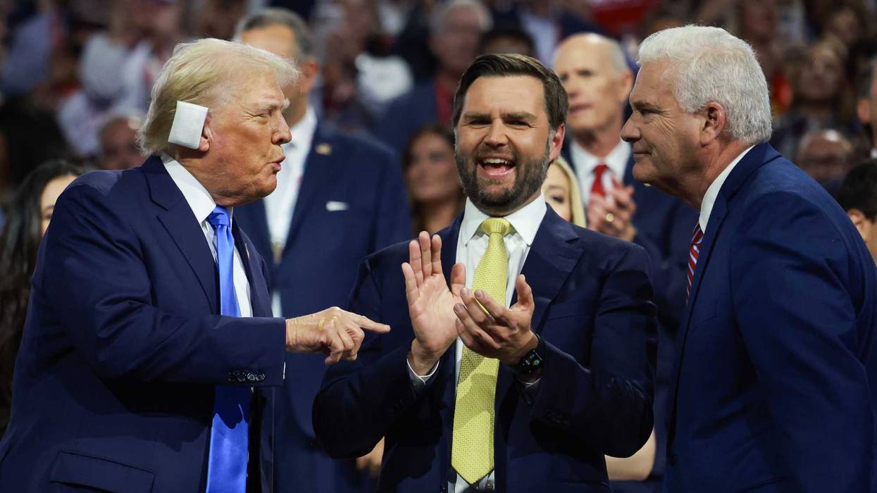 (L-R) Republican presidential candidate, former U.S. President Donald Trump speaks with Republican vice presidential candidate, U.S. Sen. J.D. Vance (R-OH) and House Majority Whip Rep. Tom Emmer (R-MN) on the second day of the Republican National Convention at the Fiserv Forum on July 16, 2024 in Milwaukee, Wisconsin.