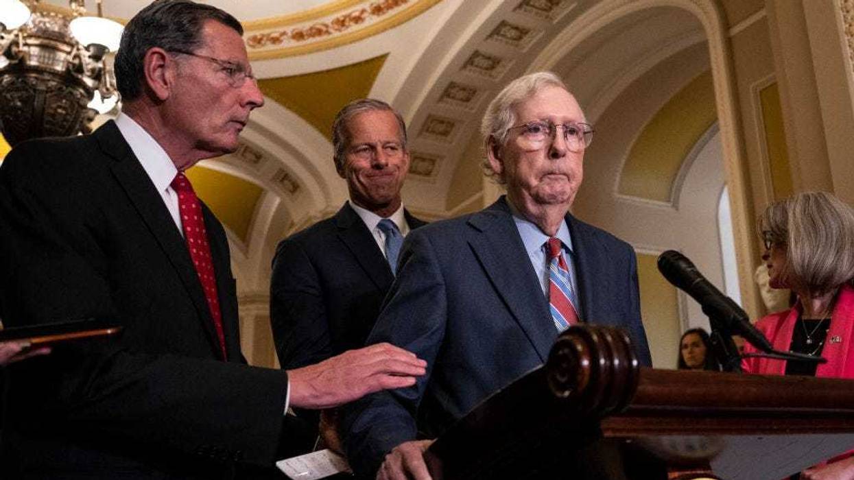 (L-R) Sen. John Barrasso (R-WY) reaches out to help Senate Minority Leader Mitch McConnell (R-KY) after McConnell froze and stopped talking at the microphones during a news conference after a lunch meeting with Senate Republicans U.S. Capitol 26, 2023 in Washington, DC.