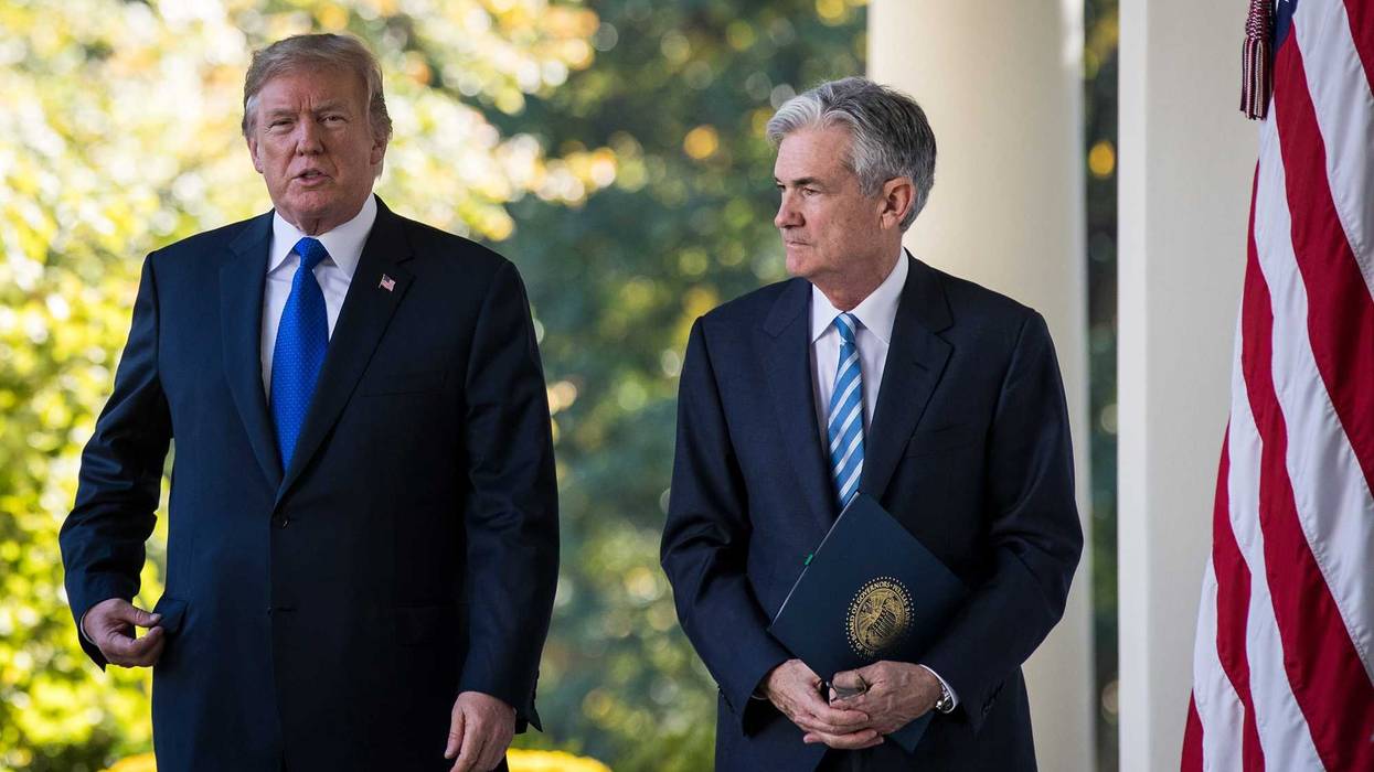 (L to R) U.S. President Donald Trump walks with Federal Reserve Jerome Powell. Trump has been pressuring the Fed to drop interest rates, something they appear unwilling to do because of economic uncertainty caused by Trump's tariff implementation.