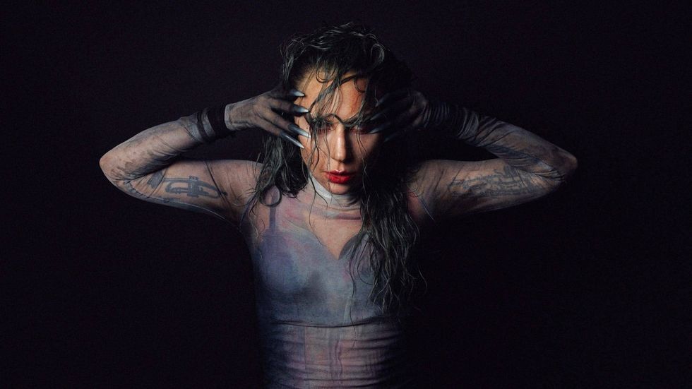 Lady Gaga fights her 'own inner demons' in video for 'Disease'