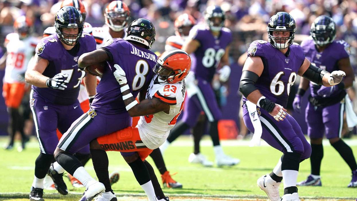 Lamar Jackson getting sacked by Demarious Randall