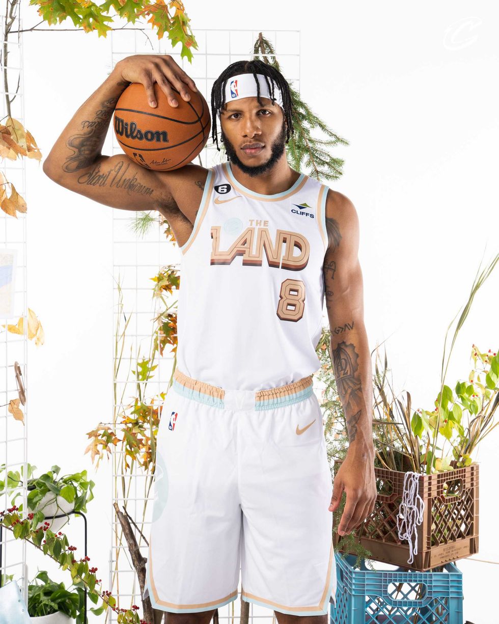 Lamar Stevens - Cleveland Cavaliers wearing "The Land" uniform in front of plants
