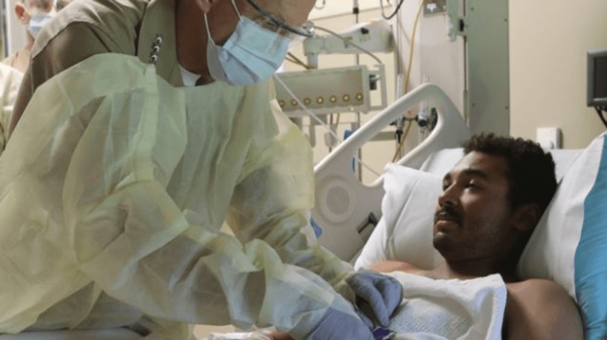 Lance Cpl. Romel Finley III in hospital bed