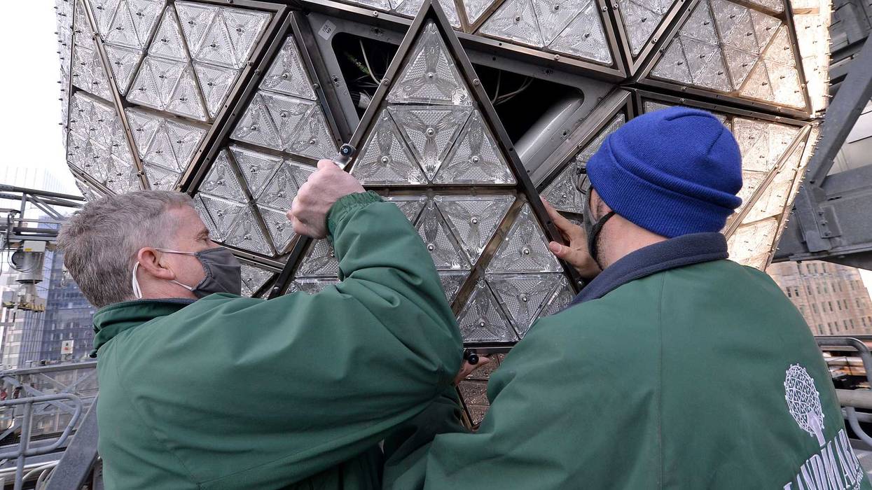 Landmark electricians Chris Sisti and Nick Bonavita demonstrate the installation of a Waterford crystal panel onto the Times Square New Year’s Eve ball, New York, NY, December 27, 2020.