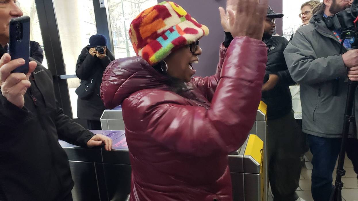 Lanetta Hinton celebrates as she becomes one millionth rider on Detroit People Mover this year