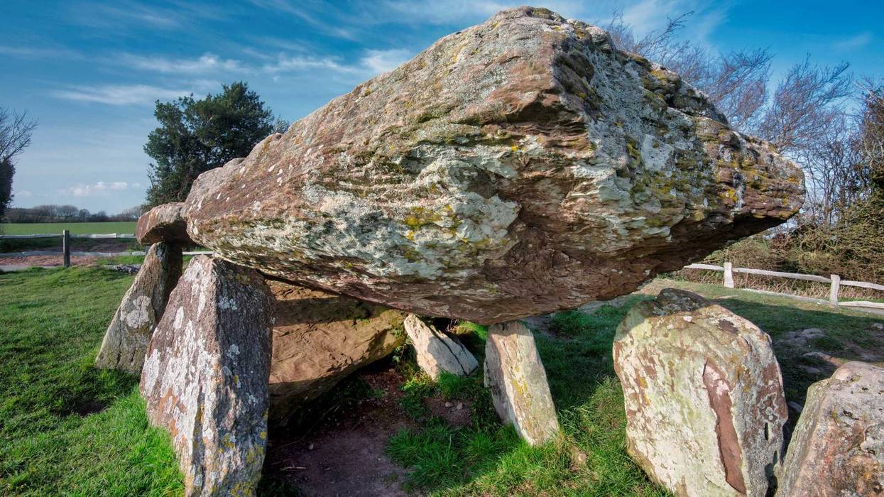 Large stones of the inner burial chamber,5000 years old. Close to Welsh border. Overlooking the Golden Valley, Herefordshire and the Wye Valley, linked to King Arthur. Sunny spring day, close to sunset.