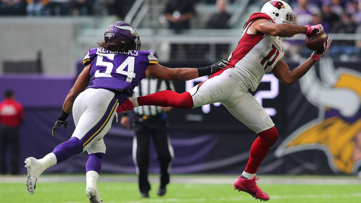 Larry Fitzgerald #11 of the Arizona Cardinals dives to catch the ball in the fourth quarter of the game against the Minnesota Vikings at U.S. Bank Stadium on October 14, 2018 in Minneapolis, Minnesota.