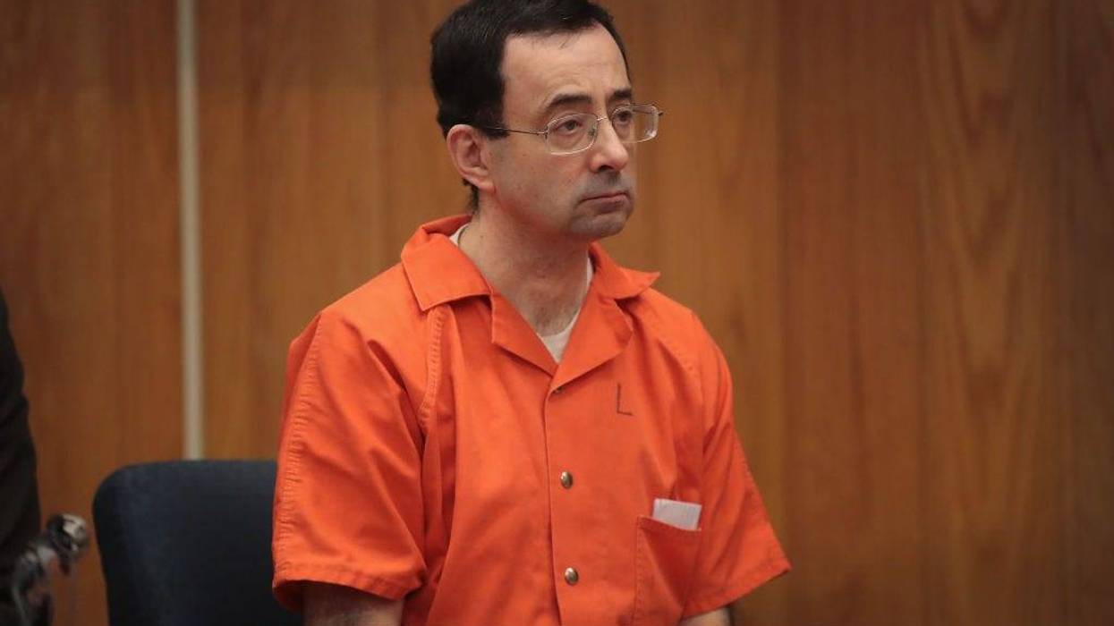 Larry Nassar sits in court listening to statements before being sentenced