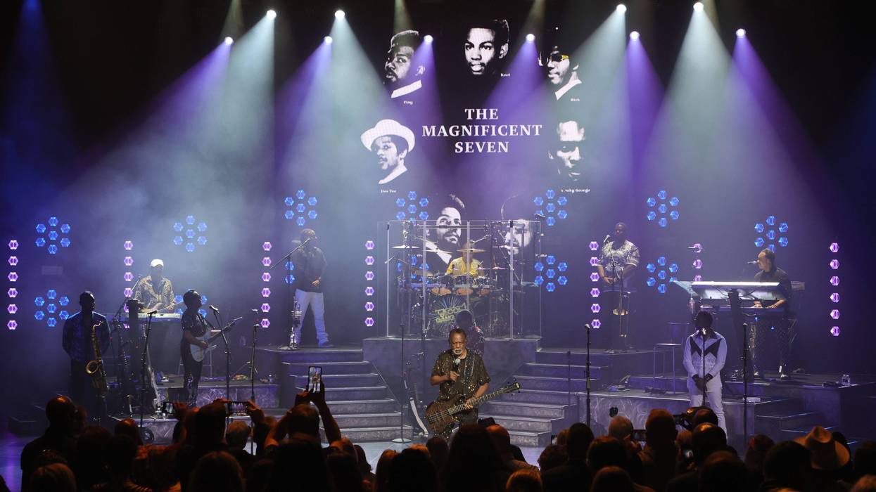 LAS VEGAS, NEVADA - OCTOBER 07: Robert "Kool" Bell (C) of Kool & the Gang talks about the original seven members of the group, shown on a screen behind him, during the VIP opening night of the band's "It's A Celebration" residency at the International Theater at the Westgate Las Vegas Resort & Casino on October 07, 2023 in Las Vegas, Nevada.