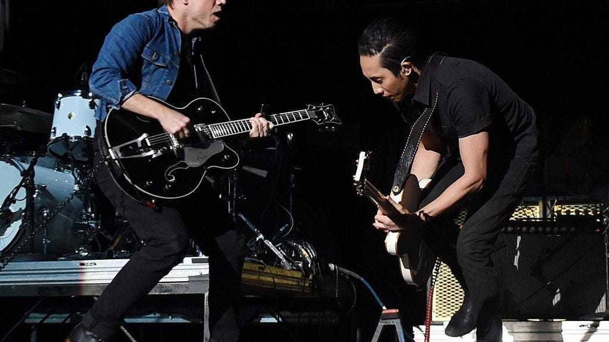LAS VEGAS, NV - DECEMBER 12: Frontman Mikel Jollett (L) and guitarist Steven Chen of The Airborne Toxic Event perform during X107.5's Holiday Havoc 2014 show at The Joint inside the Hard Rock Hotel & Casino on December 12, 2014 in Las Vegas, Nevada. (Phot
