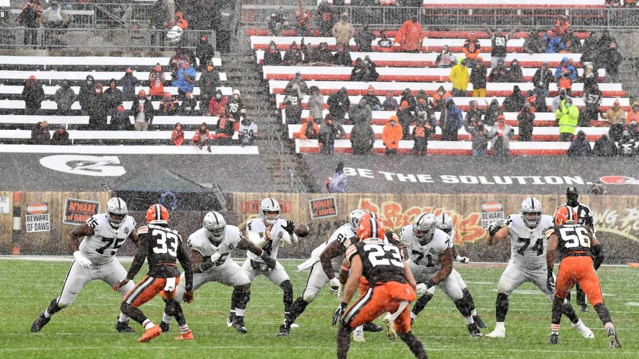 Las Vegas Raiders quarterback Derek Carr takes a snap during the first half against the Cleveland Browns at FirstEnergy Stadium.