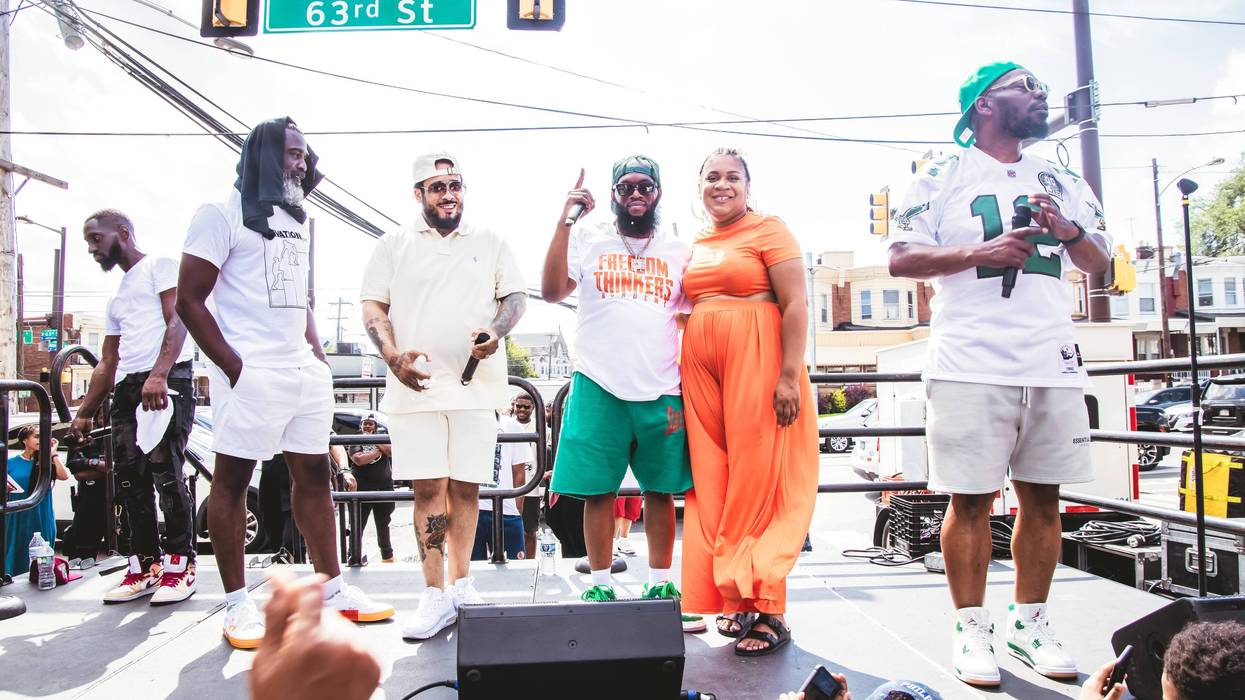 LaTrista Webb (second from right) shares the stage at the Elevation Project's record clearing clinic block party on July 29, 2023 with rappers Peedi Crakk, Freeway and Beanie Sigel.
