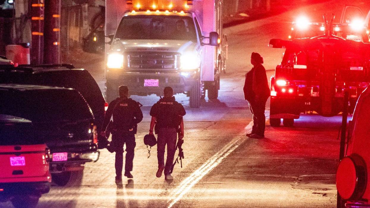 Law enforcement officers from multiple agencies continue to investigate the scene on Monday, July 29, 2019 where four people were killed and another 15 injured during the Gilroy Garlic Festival.