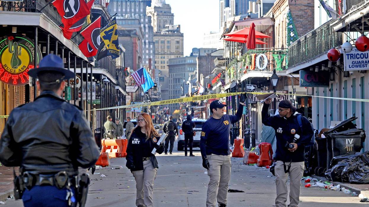 Law enforcement officers from multiple agencies work the scene on Bourbon Street after a person drove into the crowd in the early morning hours of New Year's Day on Jan. 1, 2025, in New Orleans, Louisiana.