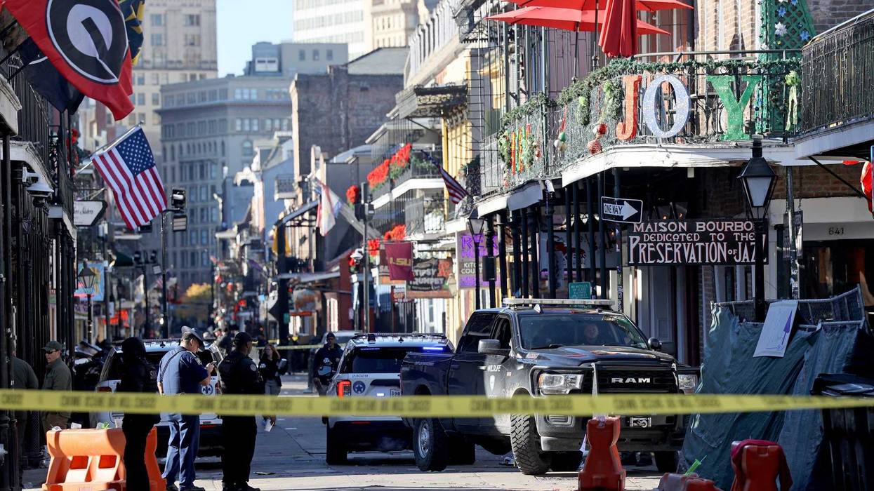 Law enforcement officers from multiple agencies work the scene