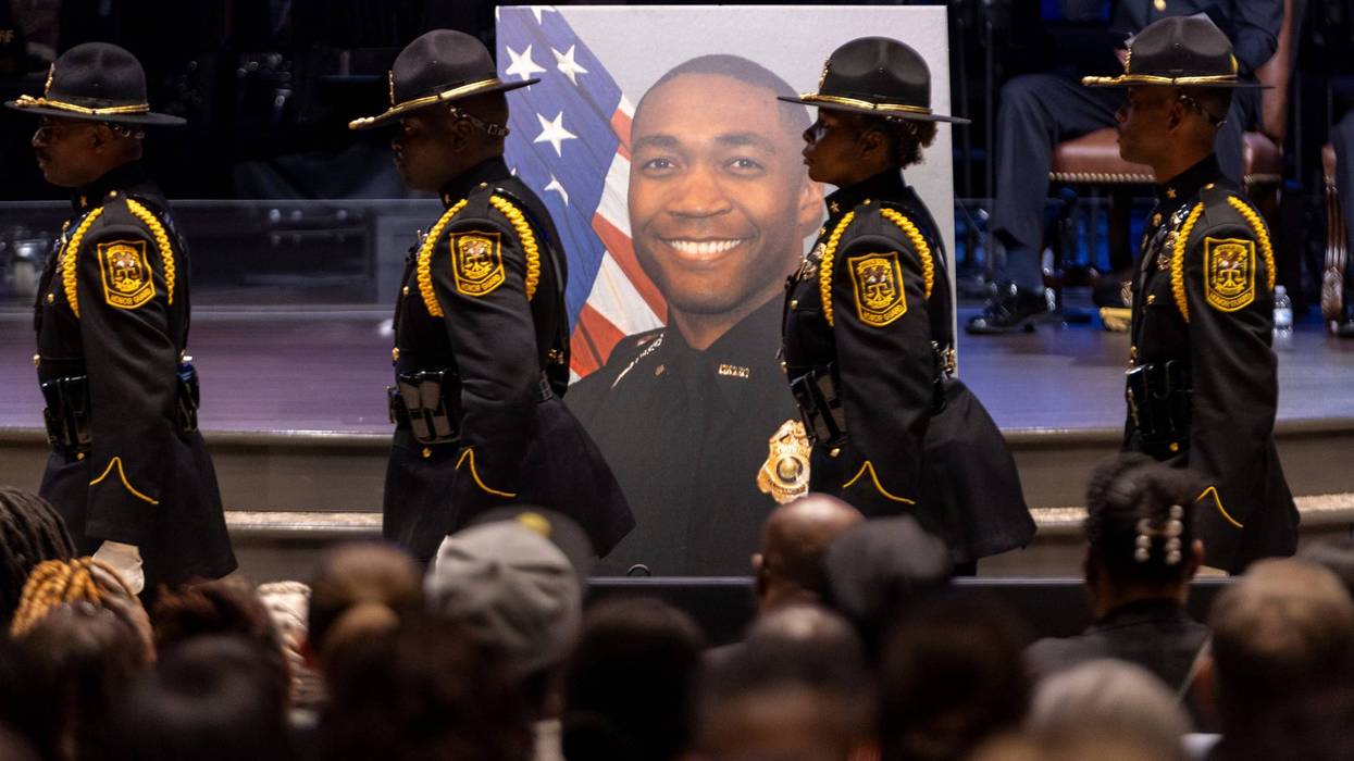 Law enforcement officers march during the funeral of DeKalb County Police Officer David Rose, who was killed while responding to a shooting at the CDC, at First Baptist Church Atlanta, Friday, Aug. 22, 2025, in Atlanta.