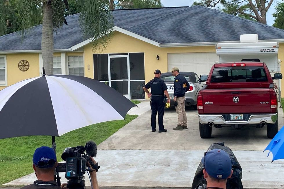 Law enforcement officials investigate home of a young man wanted for questioning in the disappearance of his girlfriend, Gabby Petito, on Monday, Sept. 20, 2021 in North Port, Fla