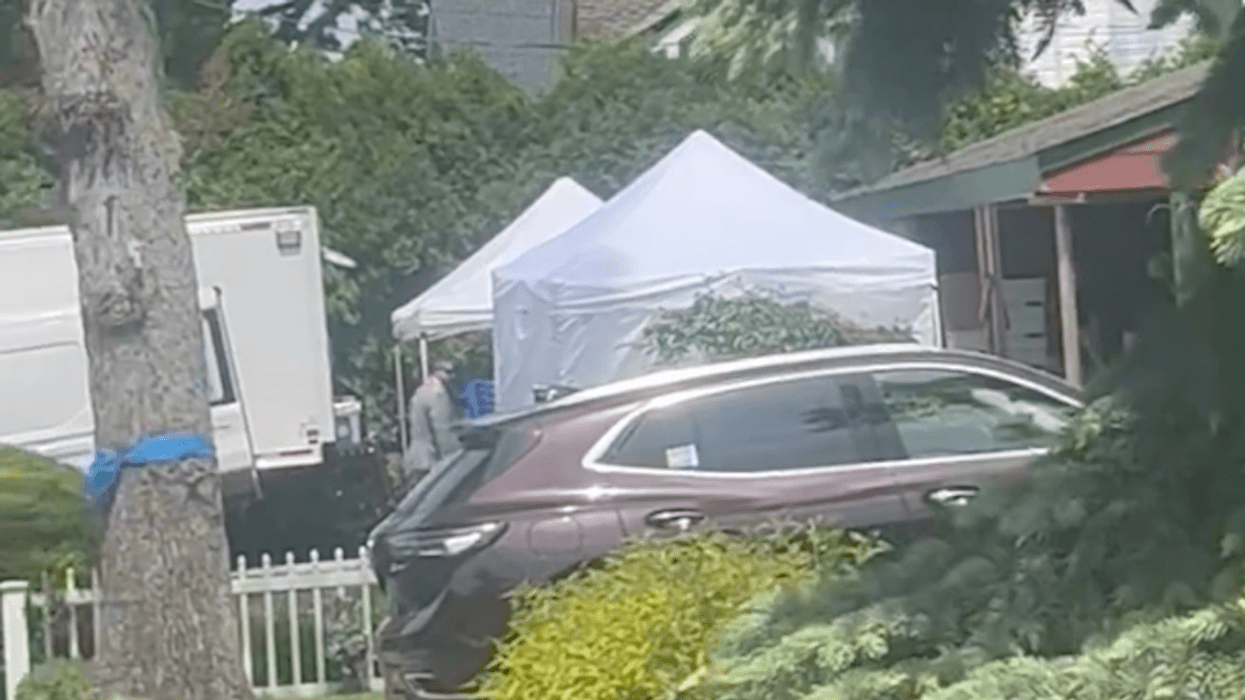 Law enforcement works at the home of Rex Heuermann on May 20, 2024