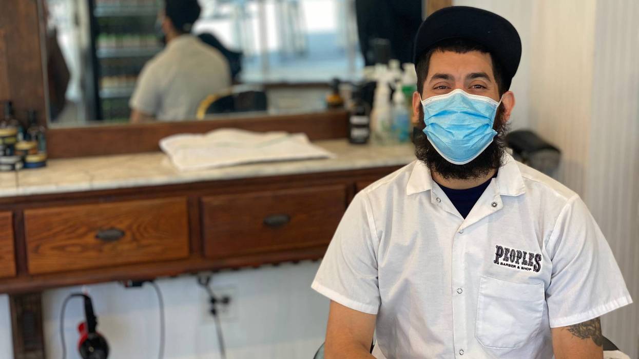 Lead Barber, Juan Sosa, at People's Barber on Polk Street, San Francisco. June 16, 2021.