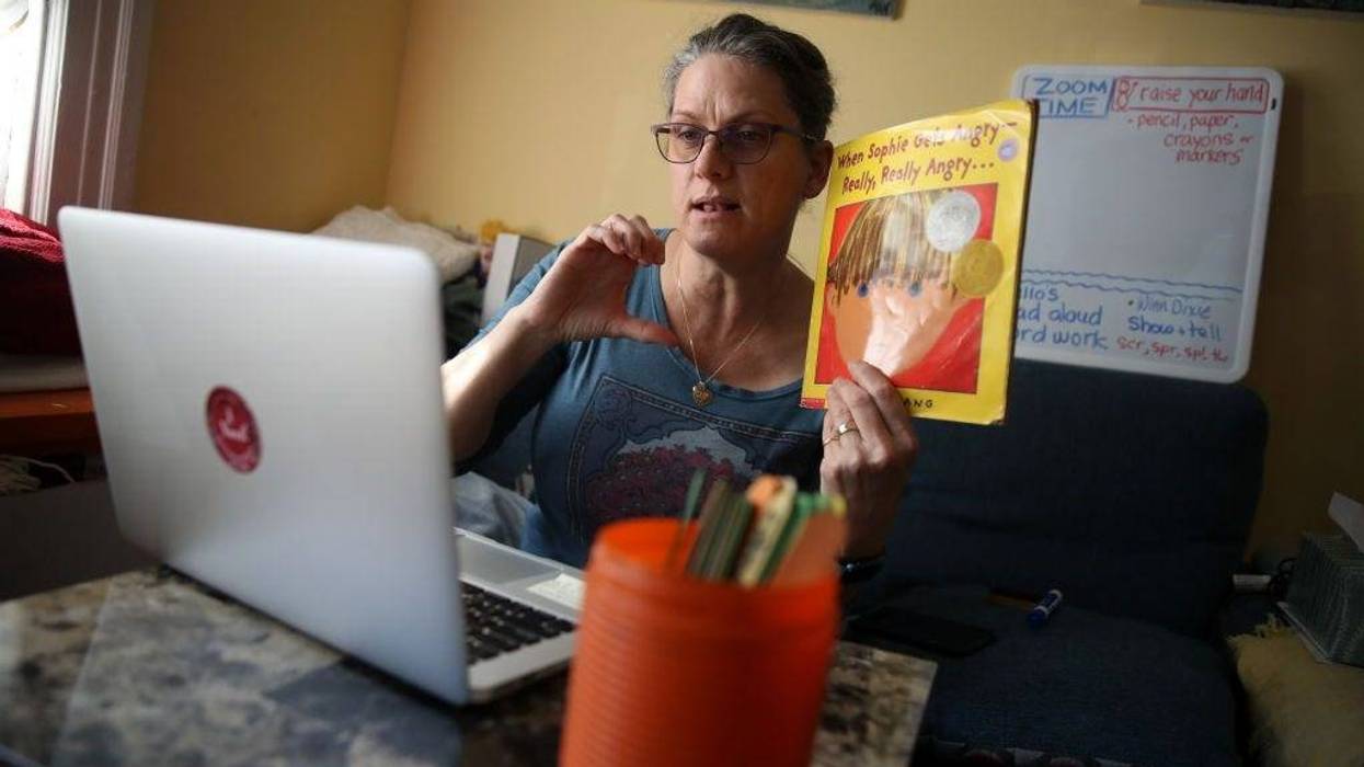 Leanne Francis, first grade teacher at Harvey Milk Civil Rights Academy, conducts an online class from her living room on March 20, 2020
