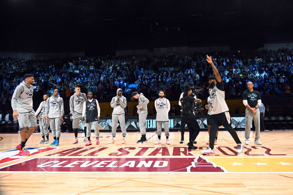 LeBron James #6 of Team LeBron waves to the fans with his teammates during the NBA All-Star practice at the Wolstein Center on February 19, 2022 in Cleveland, Ohio.