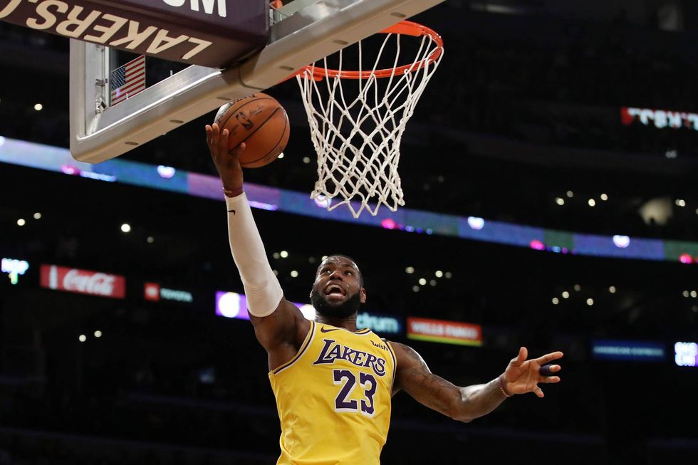 LeBron James drives to the bucket for two