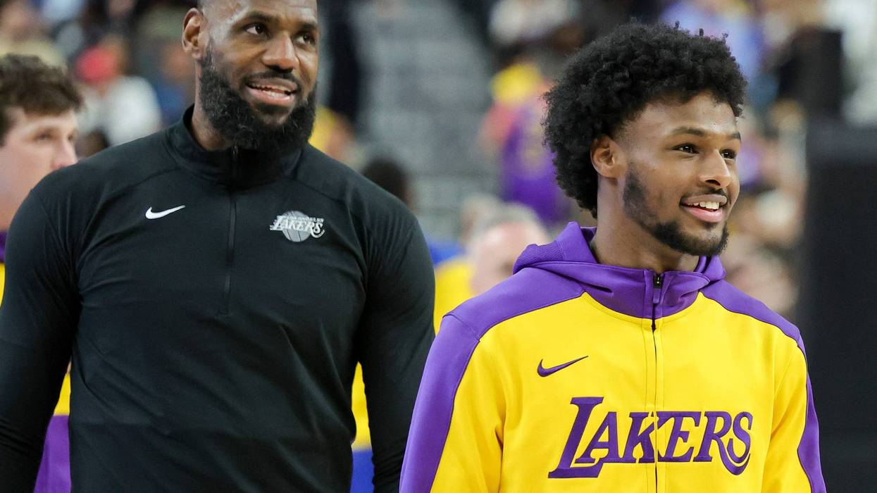 LeBron James (L) #23 and Bronny James #9 of the Los Angeles Lakers warm up before a preseason game against the Golden State Warriors at T-Mobile Arena at T-Mobile Arena on October 15, 2024 in Las Vegas, Nevada.