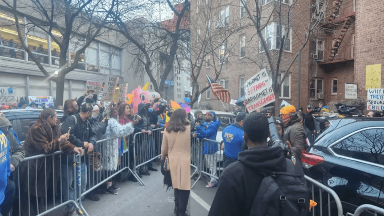 (Left) Drag Story Hour supporters positioned in front of the Queens Public Library at Jackson Heights at a similar protest in late December. (Right) Anti-LGBTQ protesters on the opposite side of the street at the December protest.