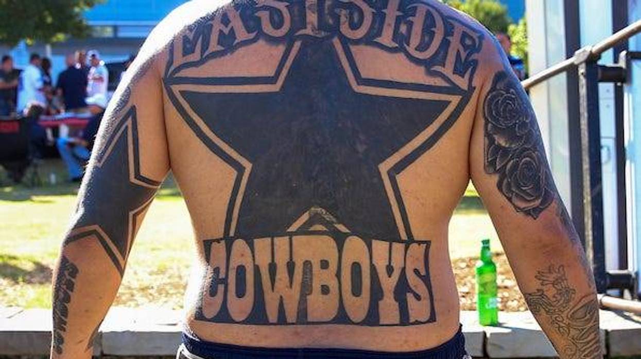 Leo Garcia from Oxnard, Calif. has the "Eastside Cowboys" tattoo on his back before a game against the Los Angeles Rams on Sunday, Oct. 1, 2017 at AT&T Stadium