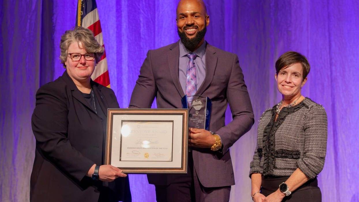 Leon Smith (center) was named the 2025 Pennsylvania Teacher of the Year.