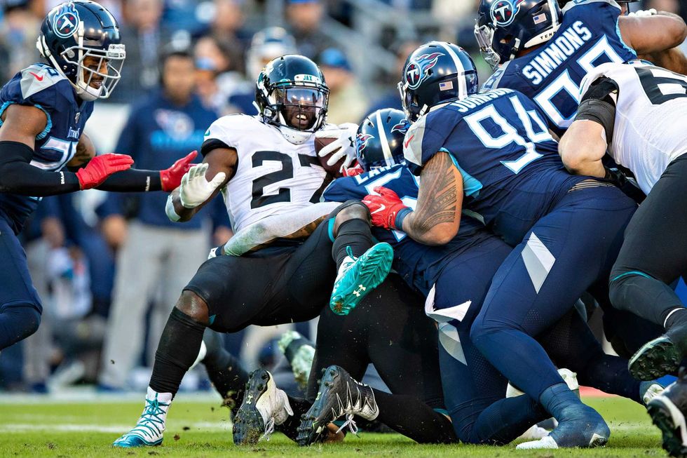 Leonard Fournette getting swallowed up by the Titans defense