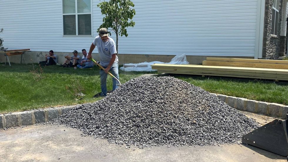 Les Moretti, owners of Smart Choice Decks, working in 95 degree heat in Philadelphia.