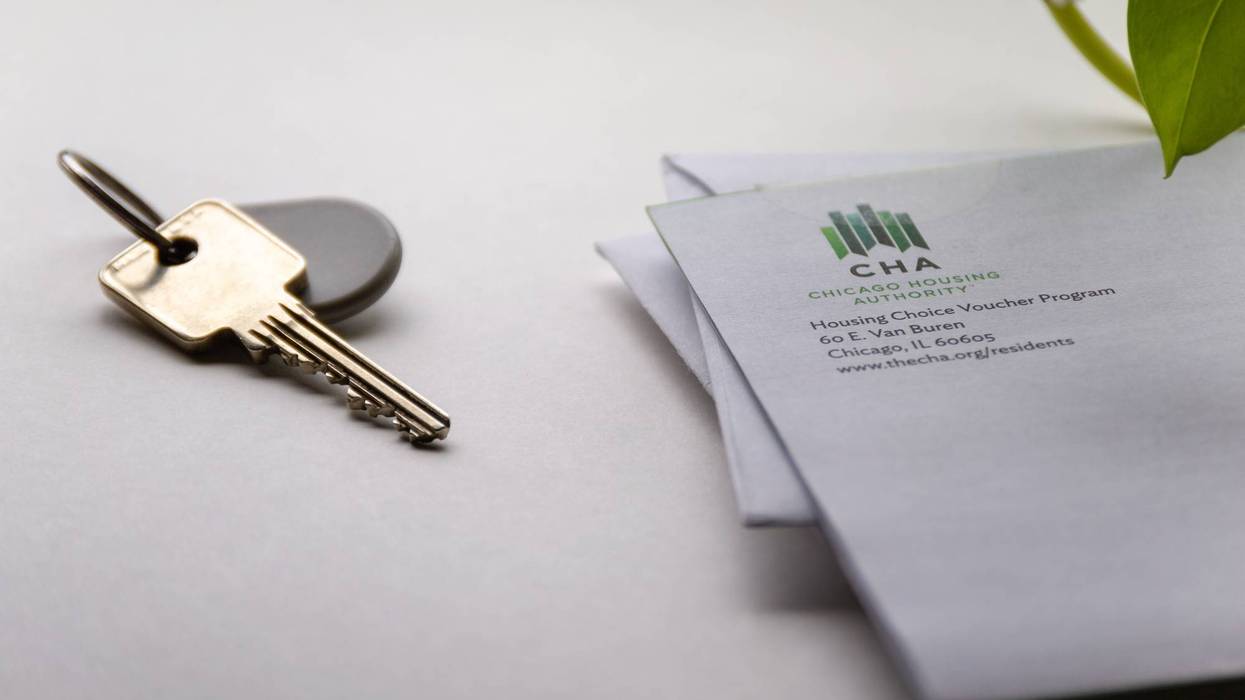 Letter from Chicago Housing Authority with keys on a counter.