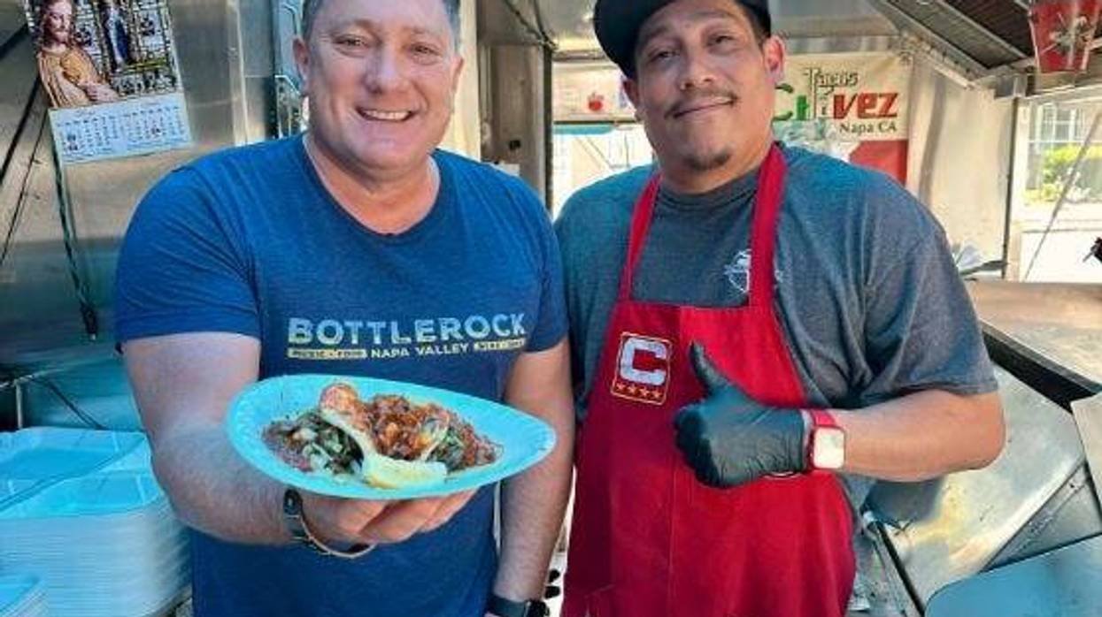 Liam Mayclem with Chef Eddie Chavez of Chavez Tacos.