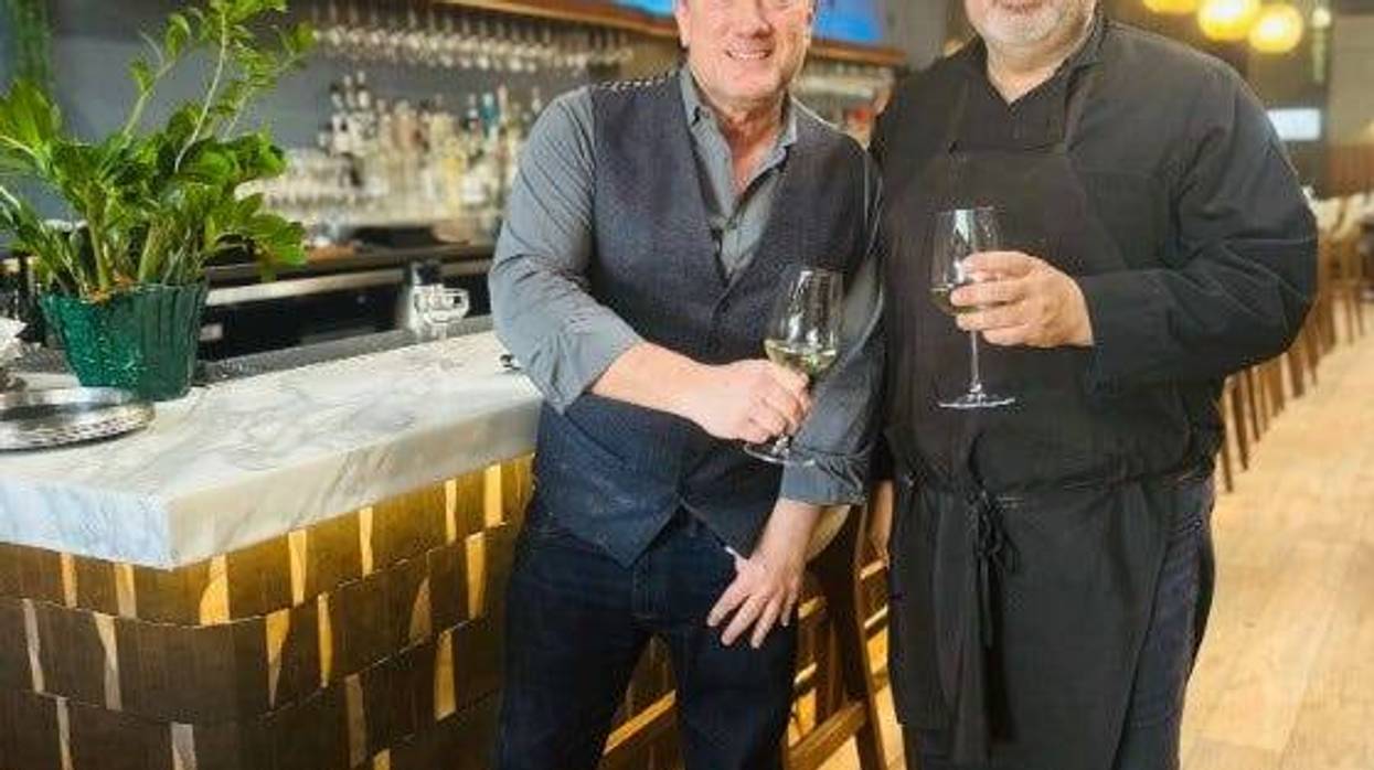 Liam Mayclem with Chef Omer Artung