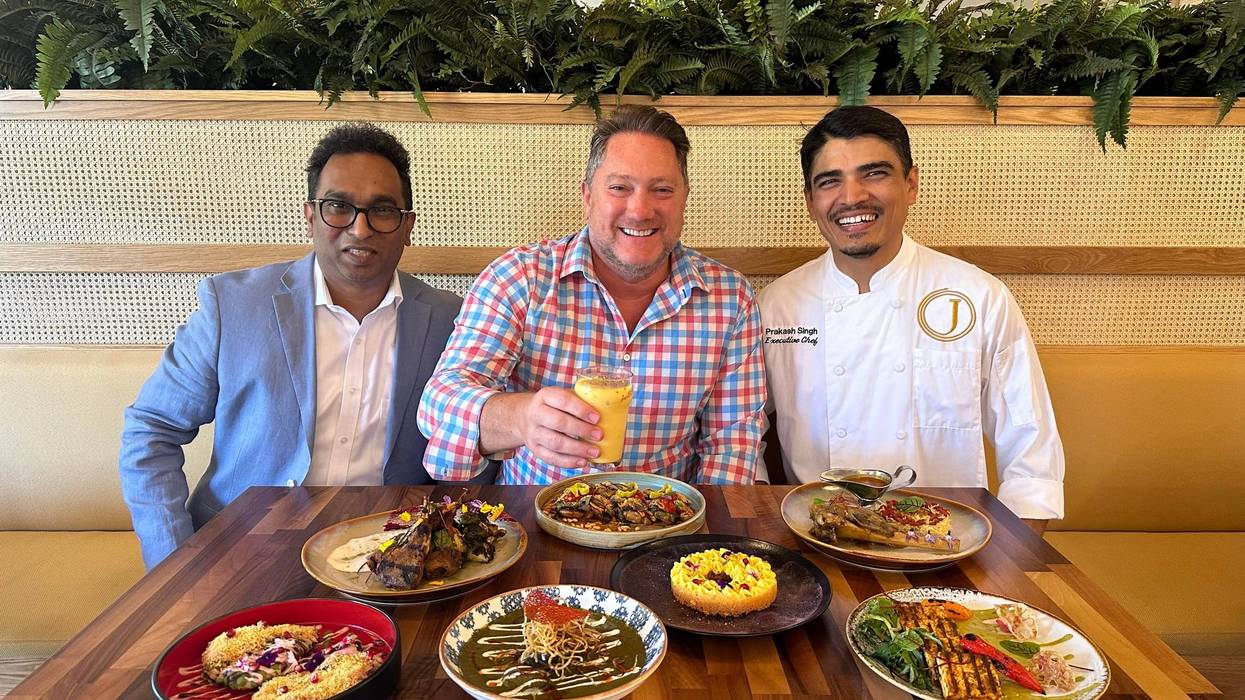 Liam Mayclem With Chef Singh at Jaks'.