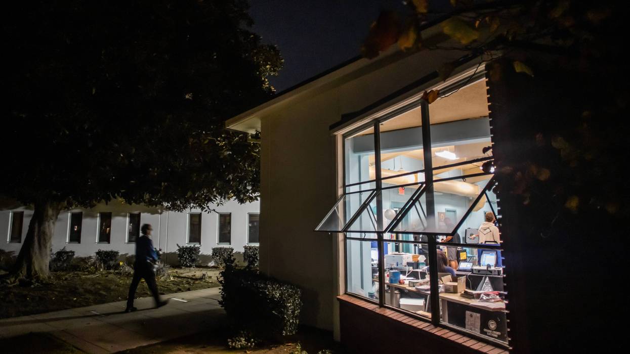 library with windows open at night