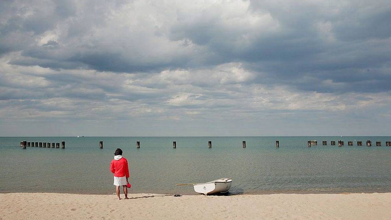 Lifeguard Ben Ingvoldscad watches over the waters of Lake Michigan at North Avenue Beach May 27, 2005 in Chicago, Illinois.
