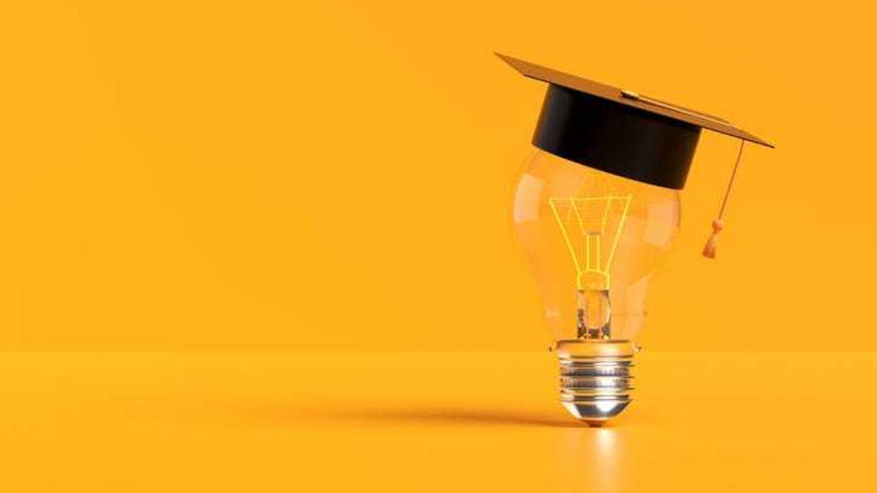 Light bulb wearing a graduation cap illuminates a yellow background, representing the power of education and innovative ideas