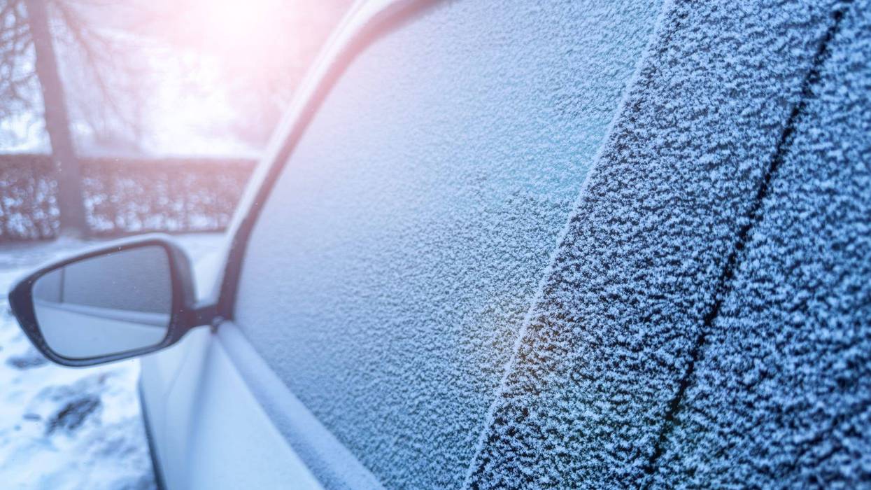 Light dusting of snow on a car's windows