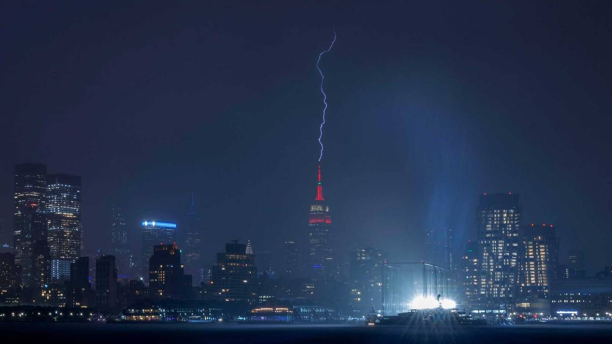 Lightning strikes the Empire State Building in New York City during a thunderstorm on May 29, 2024, as seen from Hoboken, New Jersey