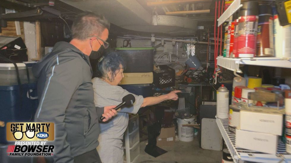 Linda shows Marty where the sewage problem comes into her basement