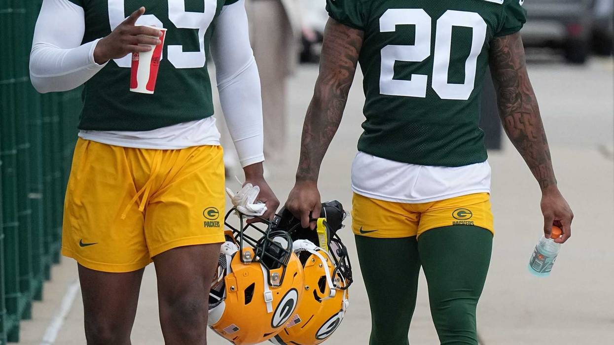 Linebacker Ty’Ron Hopper (59) and Javon Bullard arrive for organized team activities for the Green Bay Packers Tuesday,