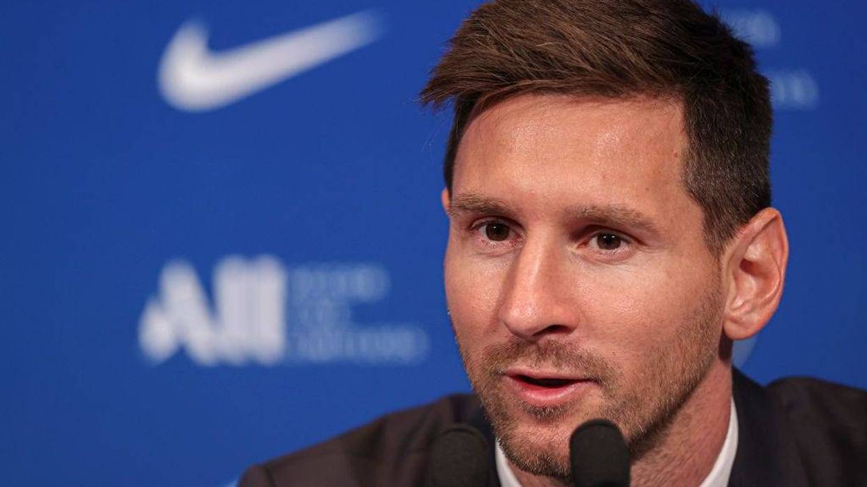 Lionel Messi answers journalists during the press conference of Paris Saint-Germain at Parc des Princes on August 11, 2021 in Paris, France.