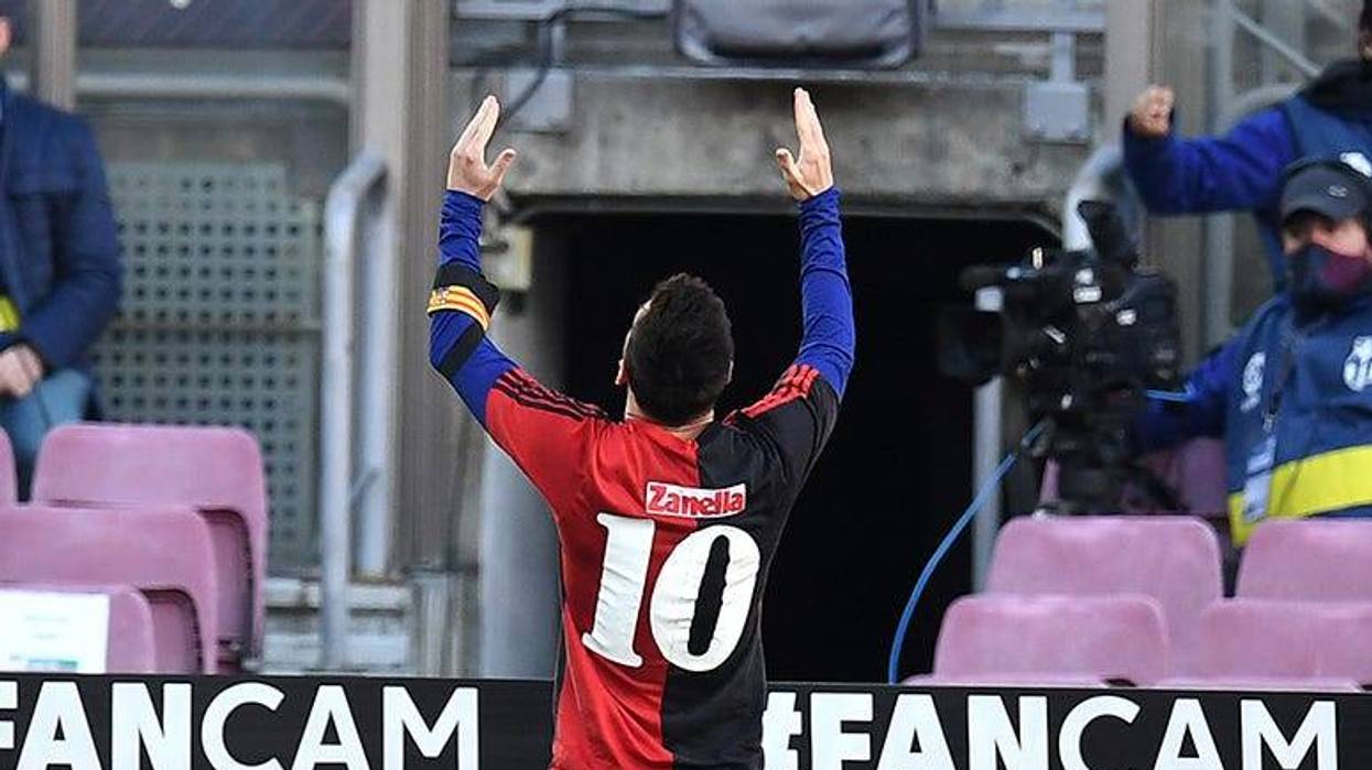 Lionel Messi of Barcelona celebrates after scoring their sides fourth goal while wearing a Newell's Old Boys shirt with the number 10 on the back in memory of former footballer, Diego Maradona, who recently passed away during the La Liga Santander match between FC Barcelona and C.A. Osasuna at Camp Nou on November 29, 2020 in Barcelona, Spain. Sporting stadiums around Spain remain under strict restrictions due to the Coronavirus Pandemic as Government social distancing laws prohibit fans inside venues resulting in games being played behind closed doors.