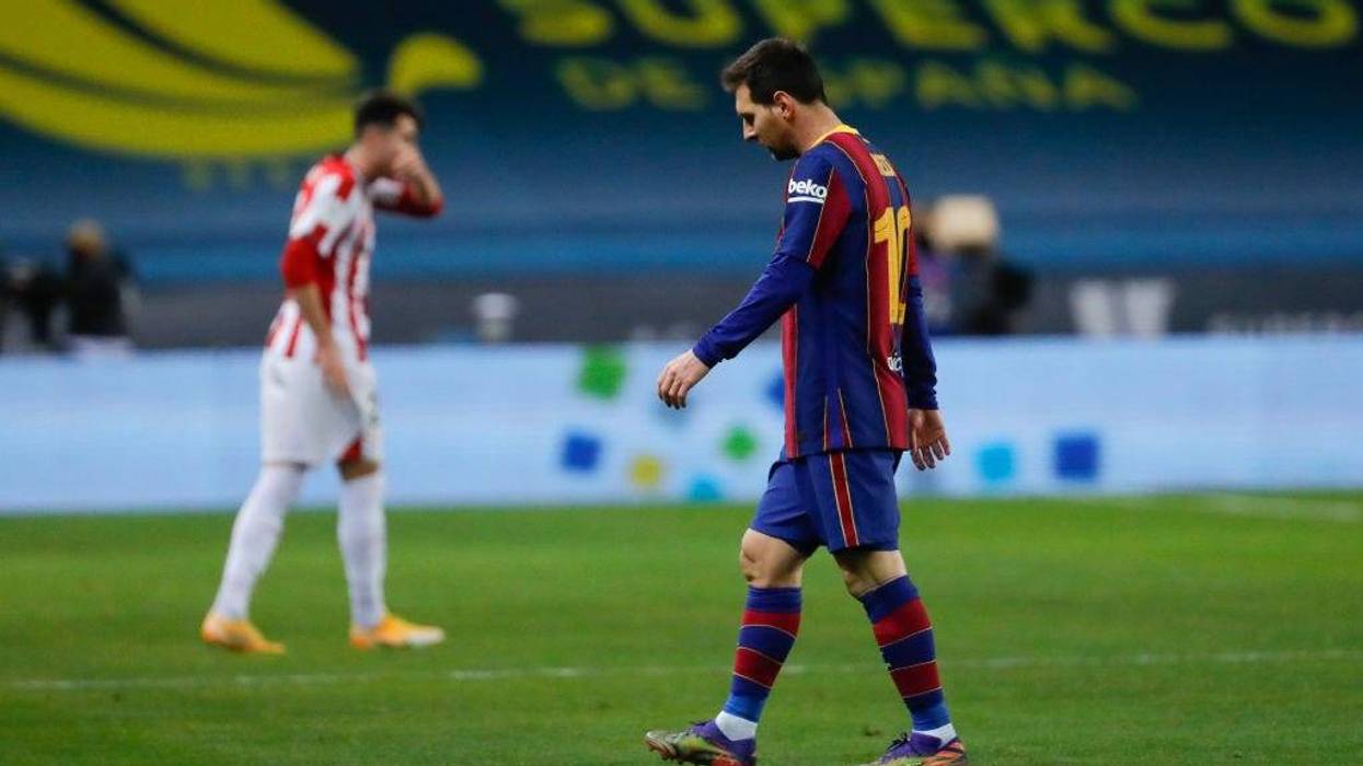 Lionel Messi of Barcelona walks off after being sent off during the Supercopa de Espana Final match between FC Barcelona and Athletic Club at Estadio de La Cartuja on January 17, 2021 in Seville, Spain. Sporting stadiums around Spain remain under strict restrictions due to the Coronavirus Pandemic as Government social distancing laws prohibit fans inside venues resulting in games being played behind closed doors.