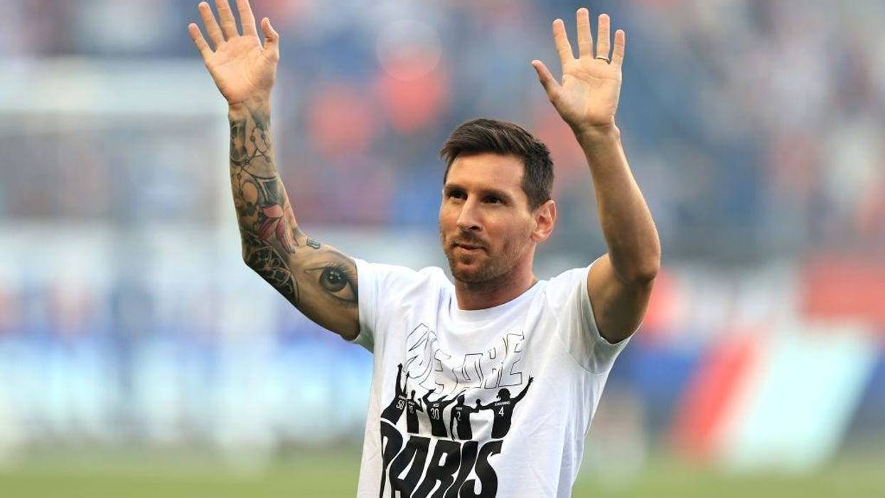 Lionel Messi of Paris Saint-Germain acknowledges the fans as he is introduced to the fans prior to the Ligue 1 Uber Eats match between Paris Saint Germain and Strasbourg at Parc des Princes on August 14, 2021 in Paris, France.