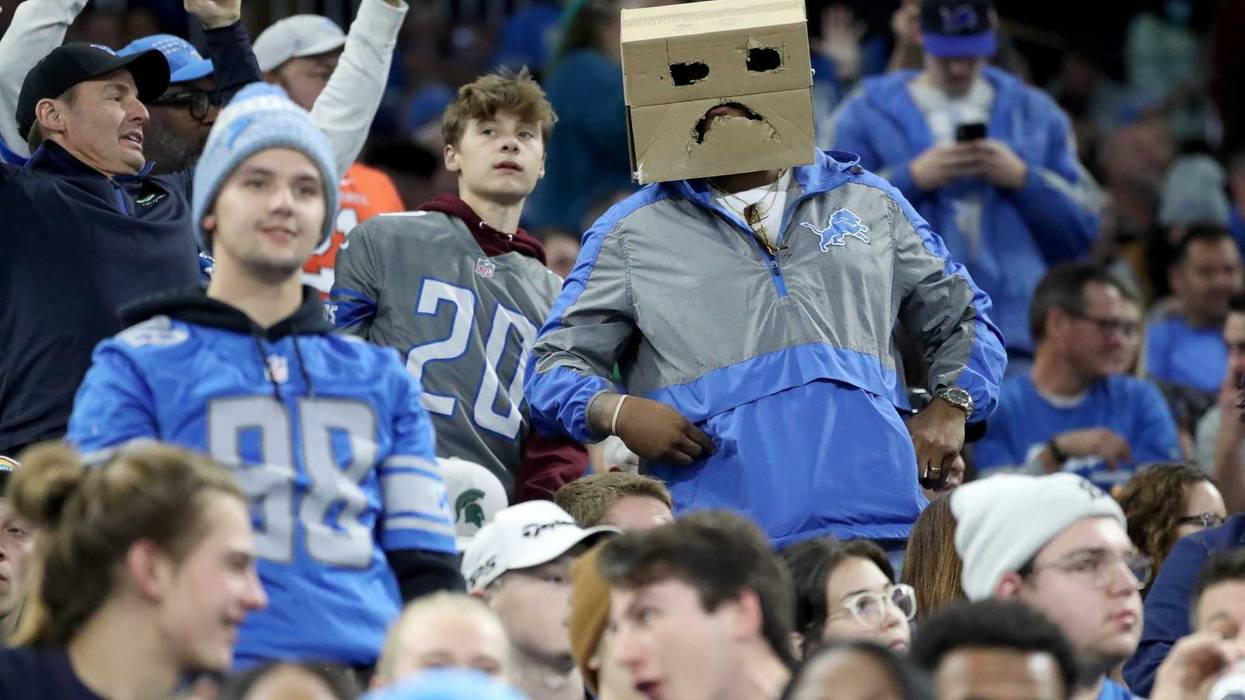 Lions fans puts a box on his head in reaction to another bad play against the Eagles during the second half of the Lions' 44-6 loss at Ford Field on Sunday, Oct. 31, 2021.