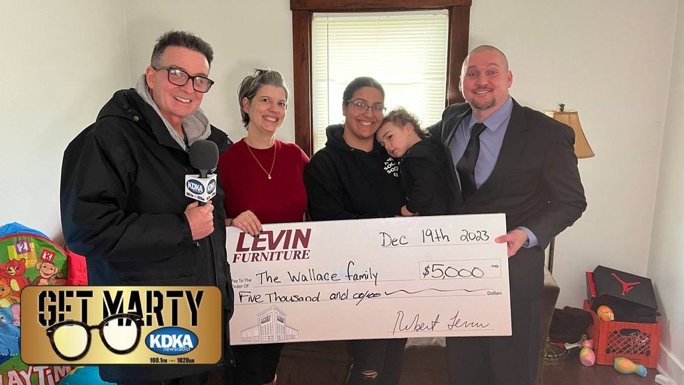 Lisa Reihl helps surprise her daughter Mikhal Wallace with Levin